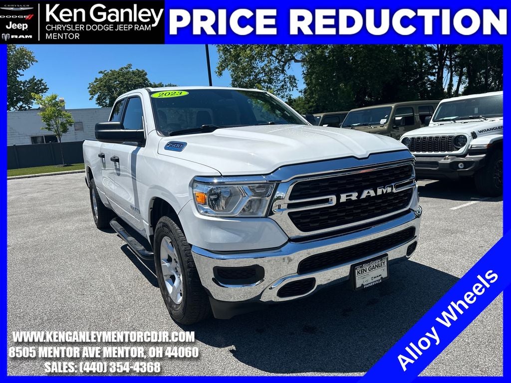 2023 RAM 1500 Big Horn Quad Cab 4x4 6'4' Box in Bright White Clearcoat — front three-quarter view
