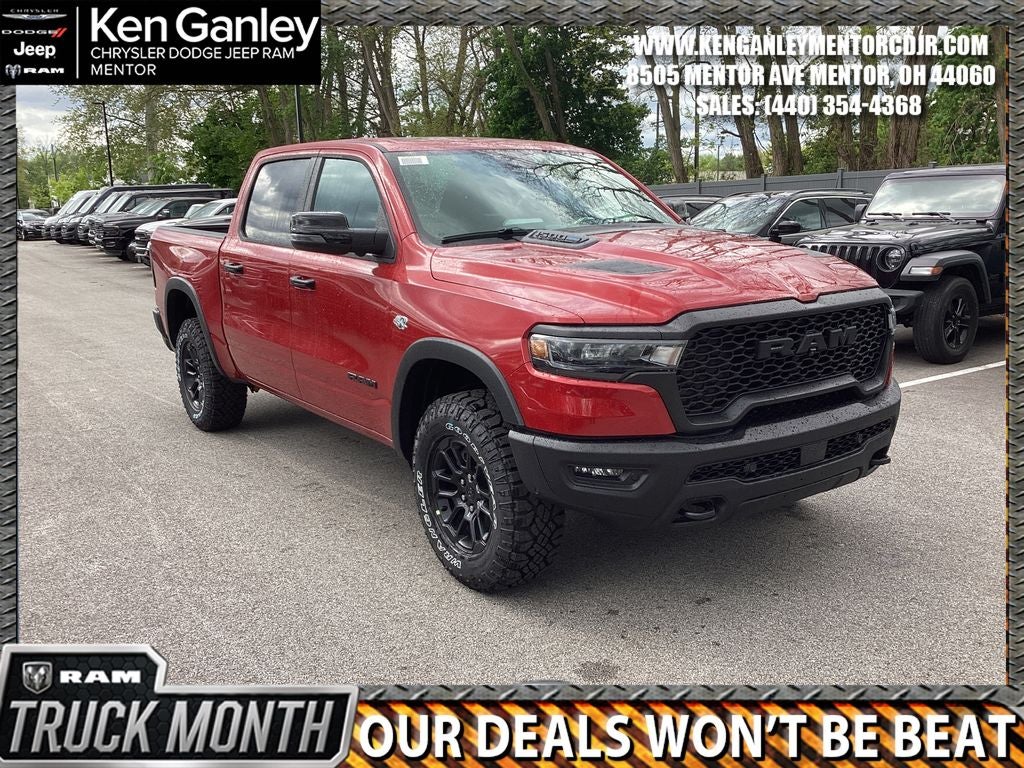 2026 RAM Ram 1500 RAM 1500 REBEL CREW CAB 4X4 5'7' BOX in Molten Red Pearl-Coat Exterior Paint — front three-quarter view