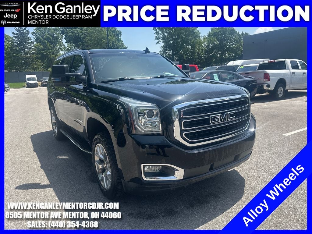 2020 GMC Yukon 4WD SLE in Onyx Black — front three-quarter view